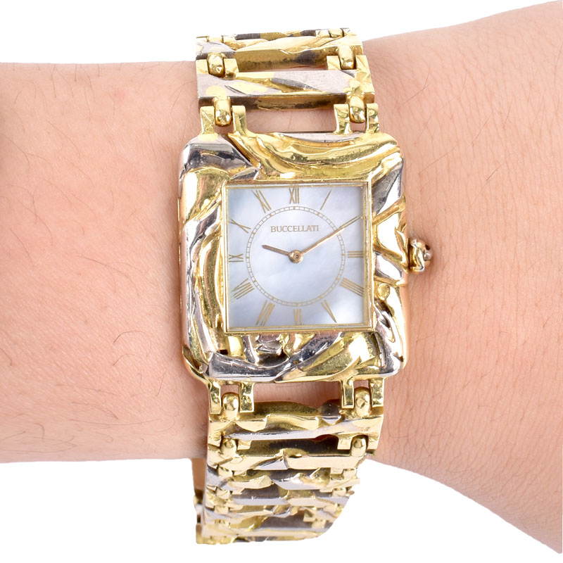 Man's Circa 1973 Buccellati Two Tone 18 Karat Gold Bracelet Watch with Mother of Pearl Dial and Manual Movement.