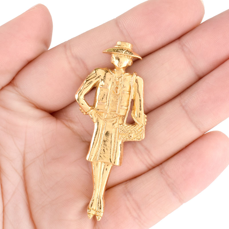 Vintage Chanel, Made in France Gold Tone Metal Figural Lady Brooch. 
