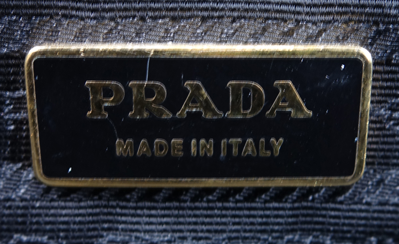 Prada Black Leather Handbag. Gold-tone hardware. Original ID tag. Lock & Keys in clouchette. Prada fabric interior.