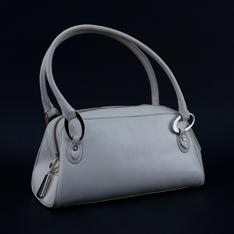 Judith Lieber White Snakeskin Handbag. Silver-tone hardware, Swarovski accents. Pink suede interior. 