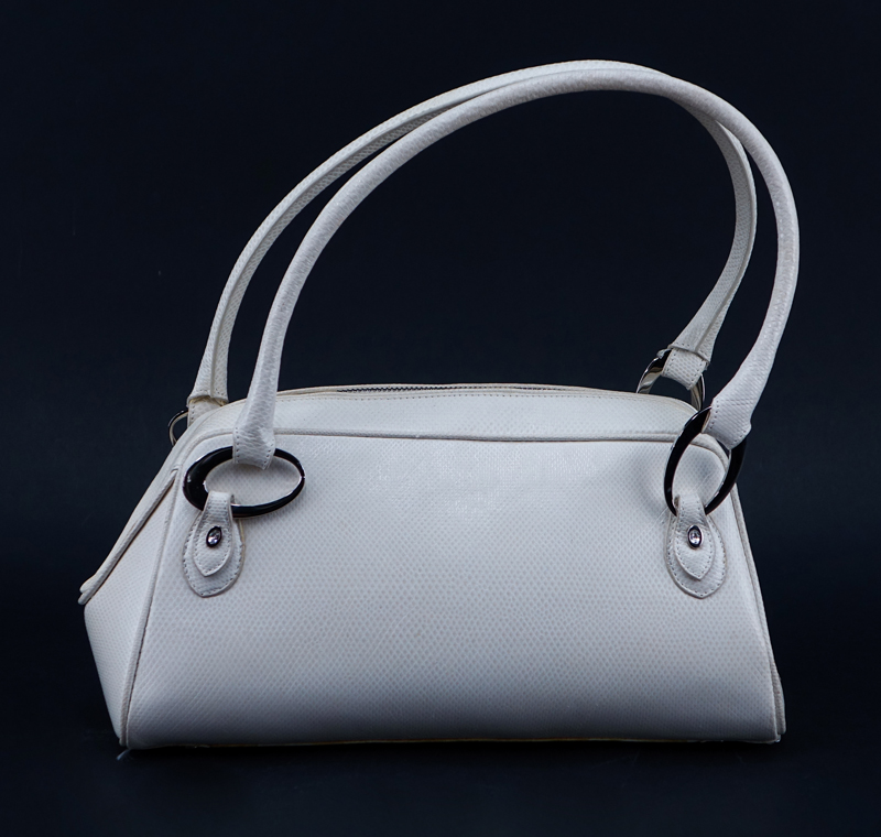 Judith Lieber White Snakeskin Handbag. Silver-tone hardware, Swarovski accents. Pink suede interior. 