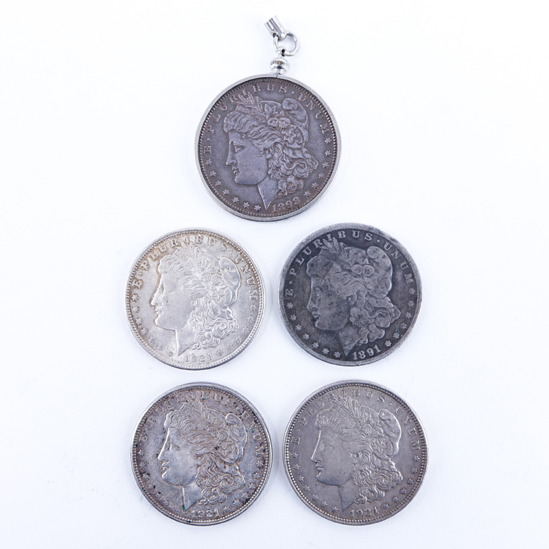 Group of Five (5): 1891-1921 Morgan Silver Dollars. Two with mint marks. One coin is mounted as a keychain or pendant.