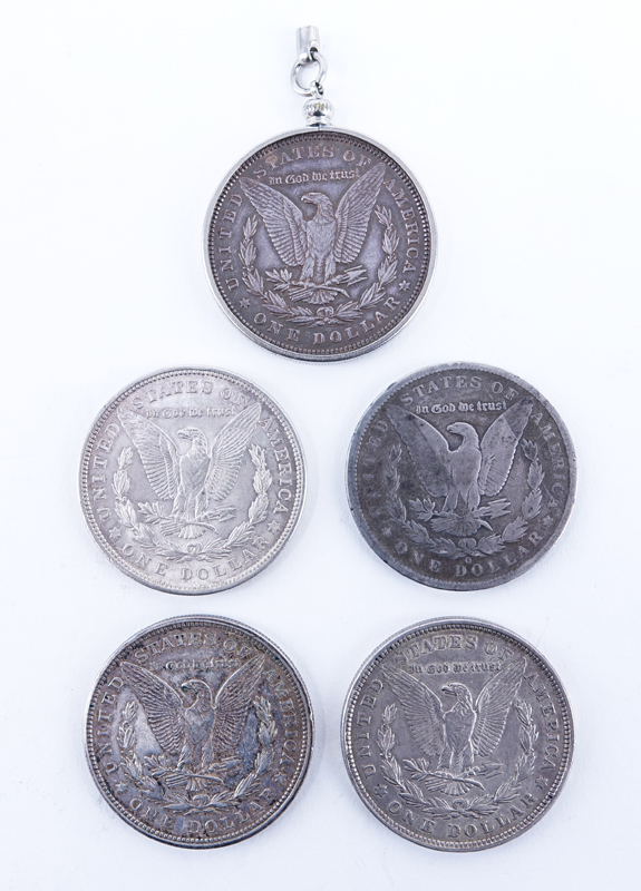 Group of Five (5): 1891-1921 Morgan Silver Dollars. Two with mint marks. One coin is mounted as a keychain or pendant.