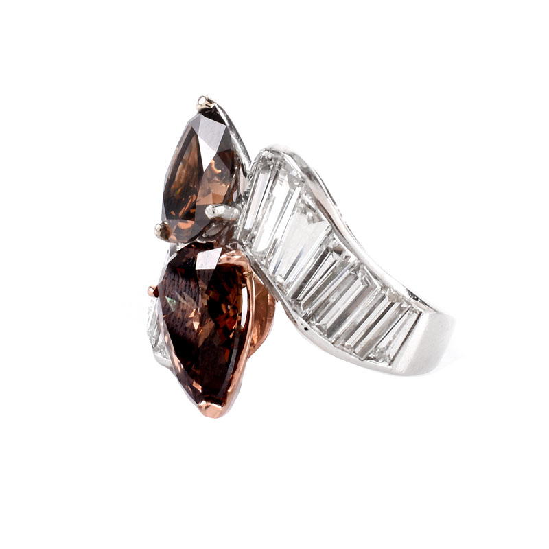 GIA Certified Vintage 4.06 and 3.04 Carat Pear Shape Fancy Dark Orangy Brown Diamond, Tapered Baguette Diamond and Platinum Cross Over Ring. 