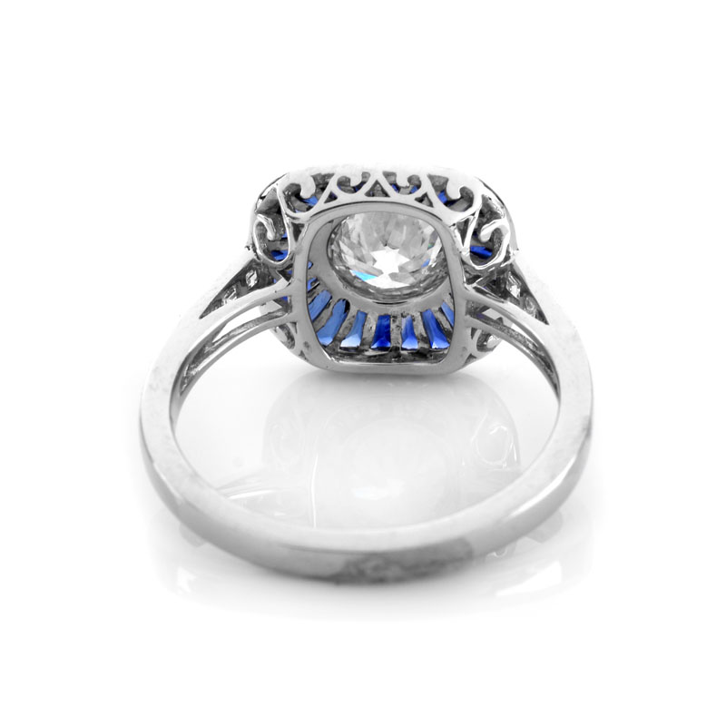 Art Deco style Approx. 1.14 Carat TW Diamond, .87 Carat Sapphire and Platinum Ring set in the Center with a .91 Carat Round Brilliant Cut Diamond. 