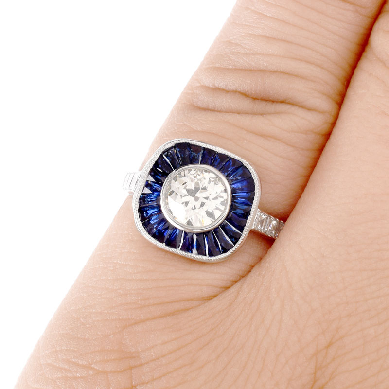 Art Deco style Approx. 1.14 Carat TW Diamond, .87 Carat Sapphire and Platinum Ring set in the Center with a .91 Carat Round Brilliant Cut Diamond. 