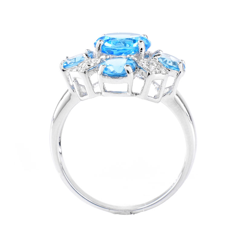 Approx. 4.86 Carat Round Cut London Topaz, Diamond and 18 Karat White Gold Ring. Topaz with vivid color. 