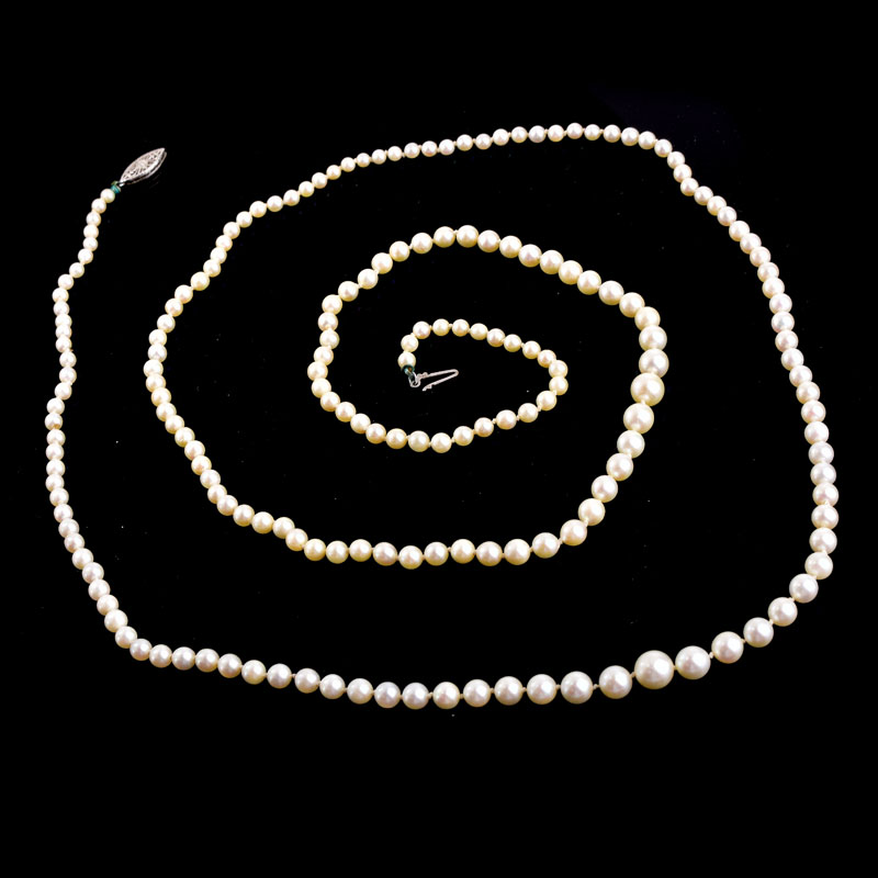 Antique Single Strand One Hundred Ninety Seven (197) Graduated White Pearl Necklace with 14 Karat White Gold Clasp.
