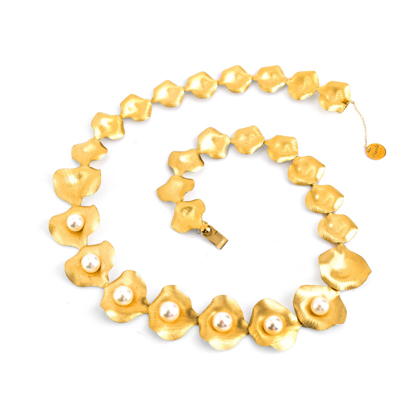 Vintage Italian 18 Karat Yellow Gold and Seven (7) White Pearl Necklace. Stamped Italy 18K. Pearls measure 8mm each.