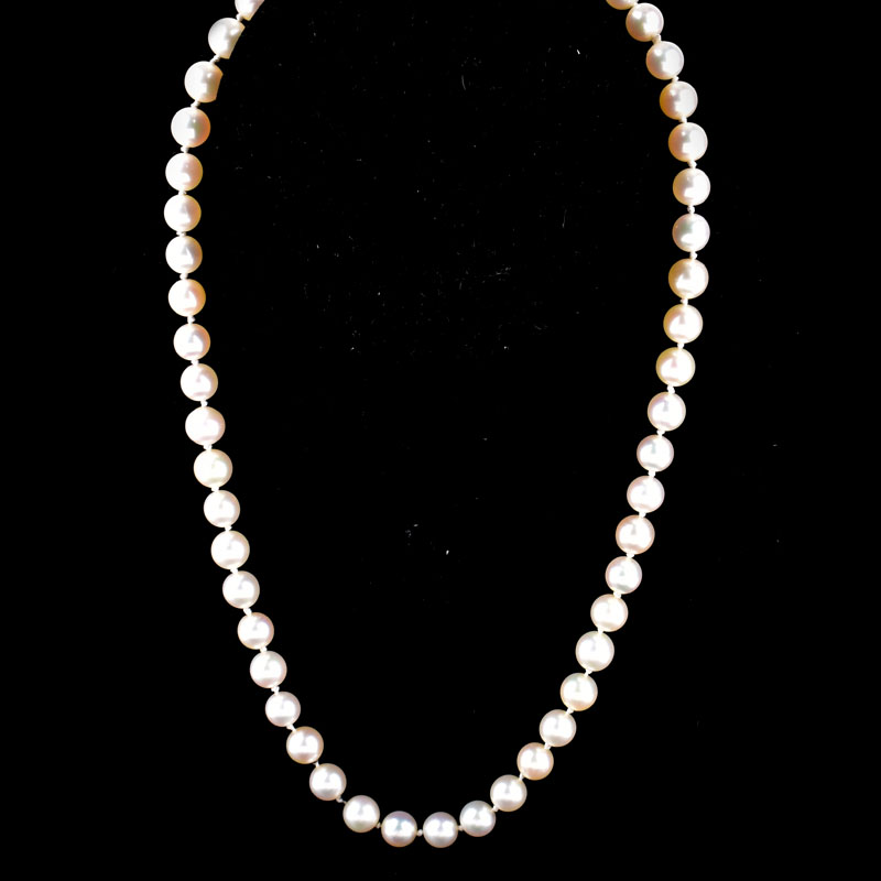 Vintage Single Strand Pearl Necklace with Gold Filled Clasp. Pearls measure 7mm each. Unsigned.