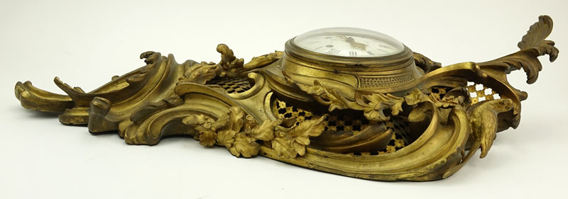 Antique French Gilt Bronze Cartel Clock. Not in running condition, rubbing to gilt. Measures 32" H x 17" W.