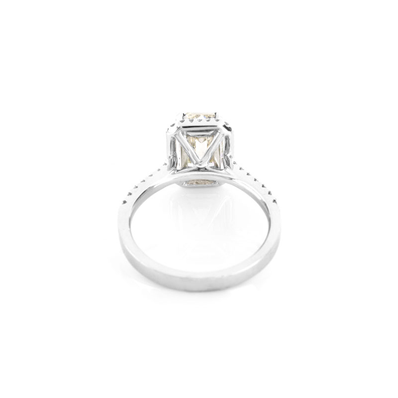 Approx. 2.10 Carat Emerald Cut Diamond and 18 Karat White Gold Engagement Ring accented throughout with Round Brilliant Cut Diamonds.
