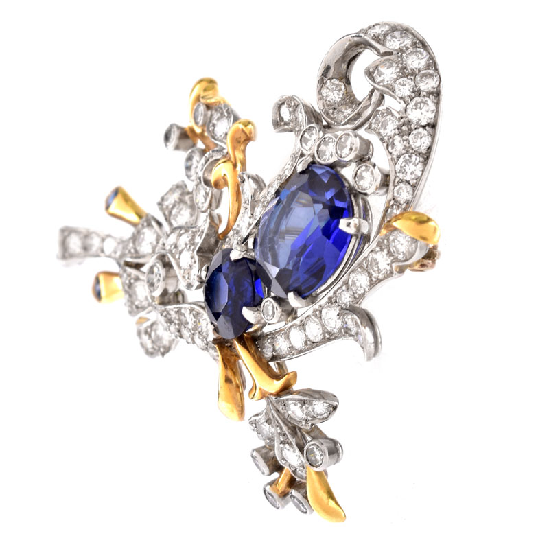 Vintage Round Brilliant Cut Diamond and 18 Karat Yellow and White Gold Brooch. Synthetic sapphire accents.