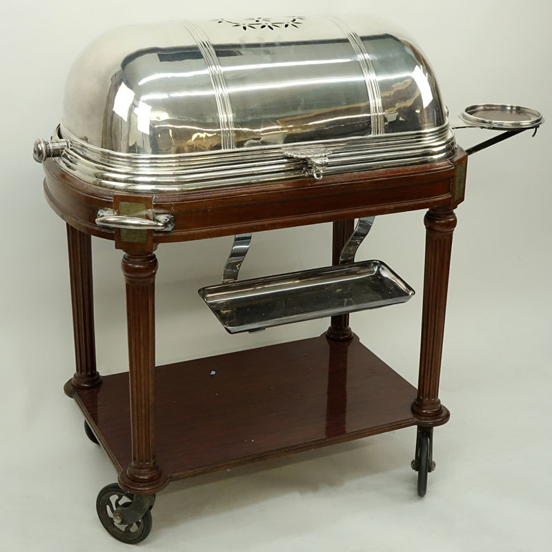 Large French Silver Plate and Carved Wood Meat Carving Trolley. Large vented dome top rolls back to reveal a removable plate and 3 sauce/gravy wells.