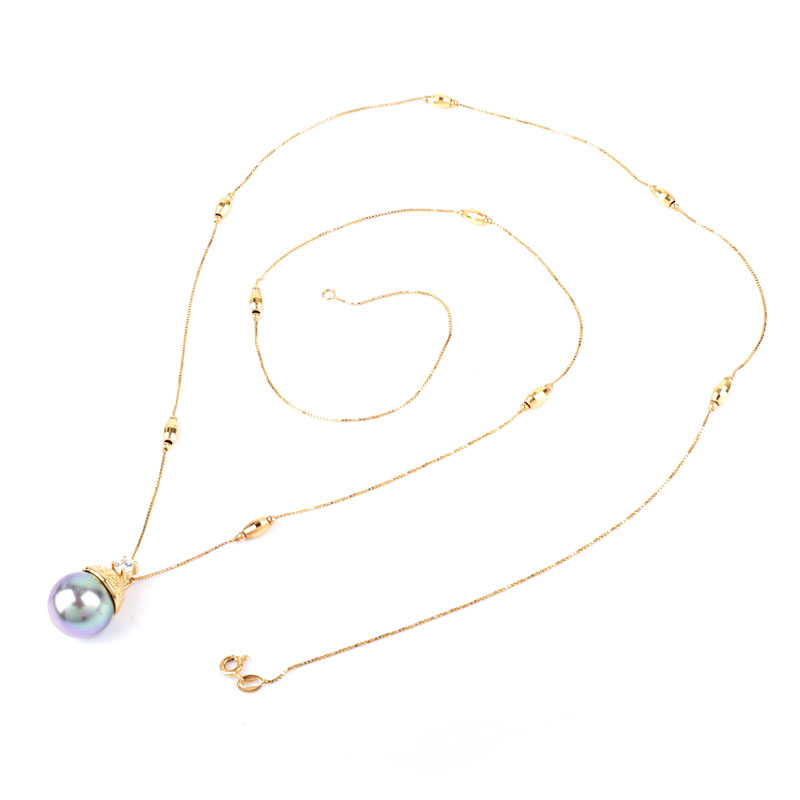 Vintage Italian Round Brilliant Cut Diamond, South Sea Pearl and 14 Karat Yellow Gold Pendant Necklace.