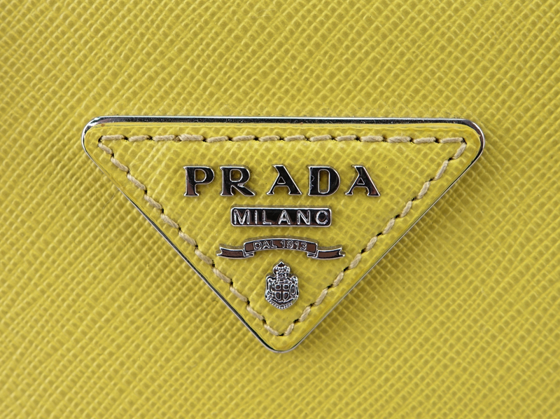 Prada Yellow Small Grained Leather Saffiano Lux Handbag.
