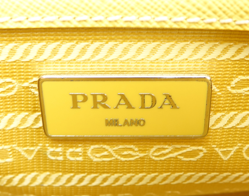 Prada Yellow Small Grained Leather Saffiano Lux Handbag.