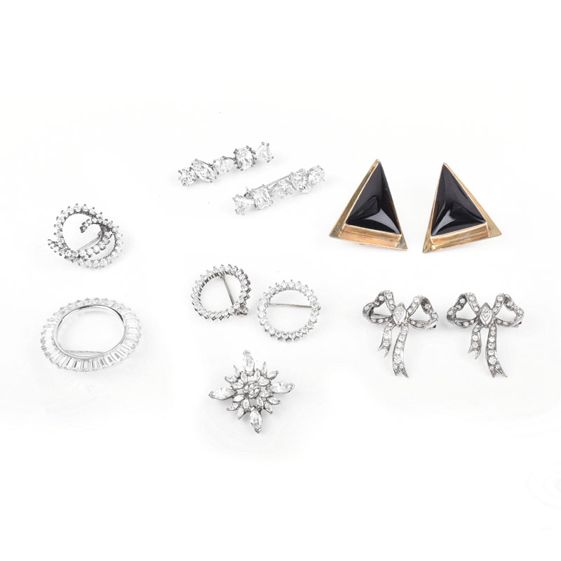 Collection of Sterling Silver Jewelry Including Nine (9) Brooches with Faux Diamonds and a Pair of Earrings.