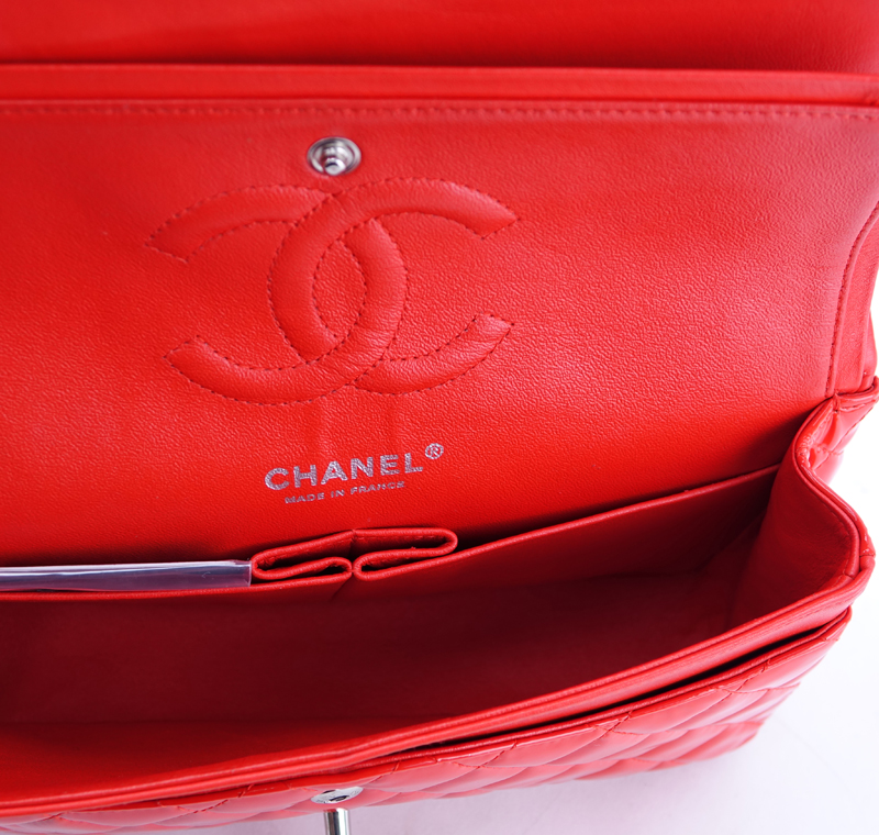 Chanel Red Quilted Patent Leather Classic Double Flap 26 Bag. Silver tone hardware, interior of red leather with zippered and patch pockets.