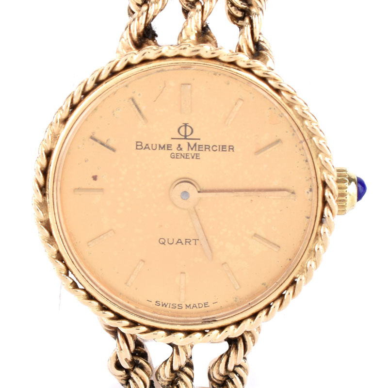 Lady's Vintage Baume & Mercier 14 Karat Yellow Gold Bracelet Watch with Quartz Movement.