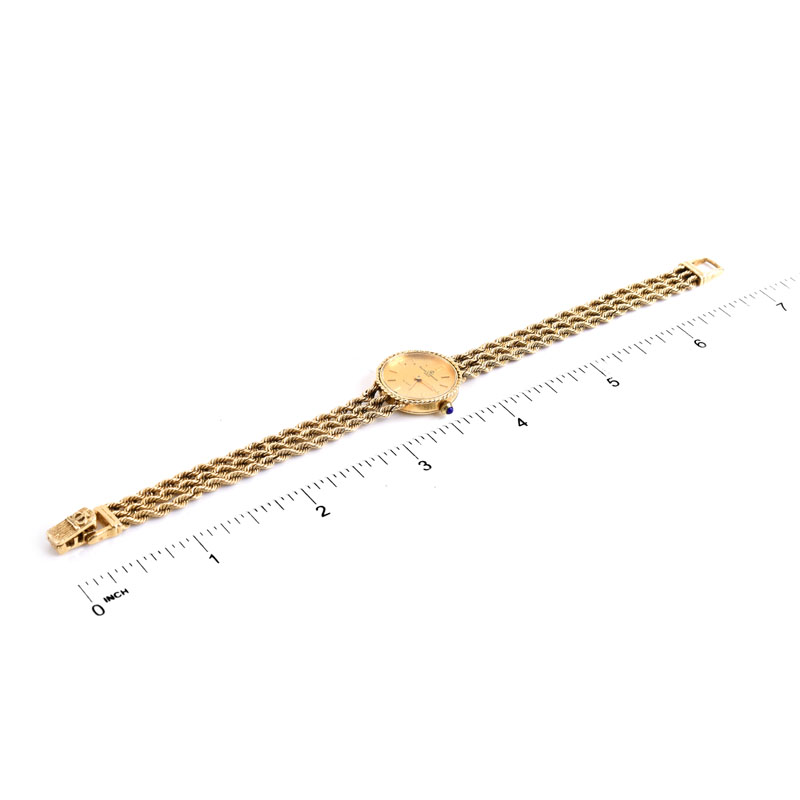 Lady's Vintage Baume & Mercier 14 Karat Yellow Gold Bracelet Watch with Quartz Movement.