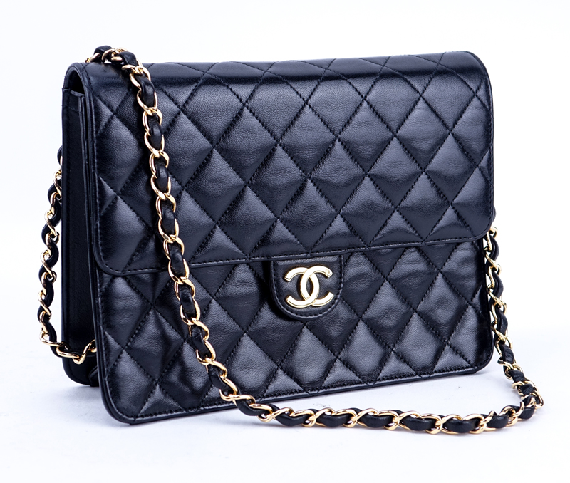 Chanel Black Quilted Leather Mademoiselle PM Handbag. Gold tone hardware.