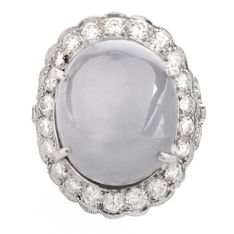 Lady's Vintage 34.24 Carat Oval Cabochon Star Sapphire, 2.70 Carat Round Brilliant Cut Diamond and Platinum Ring.
