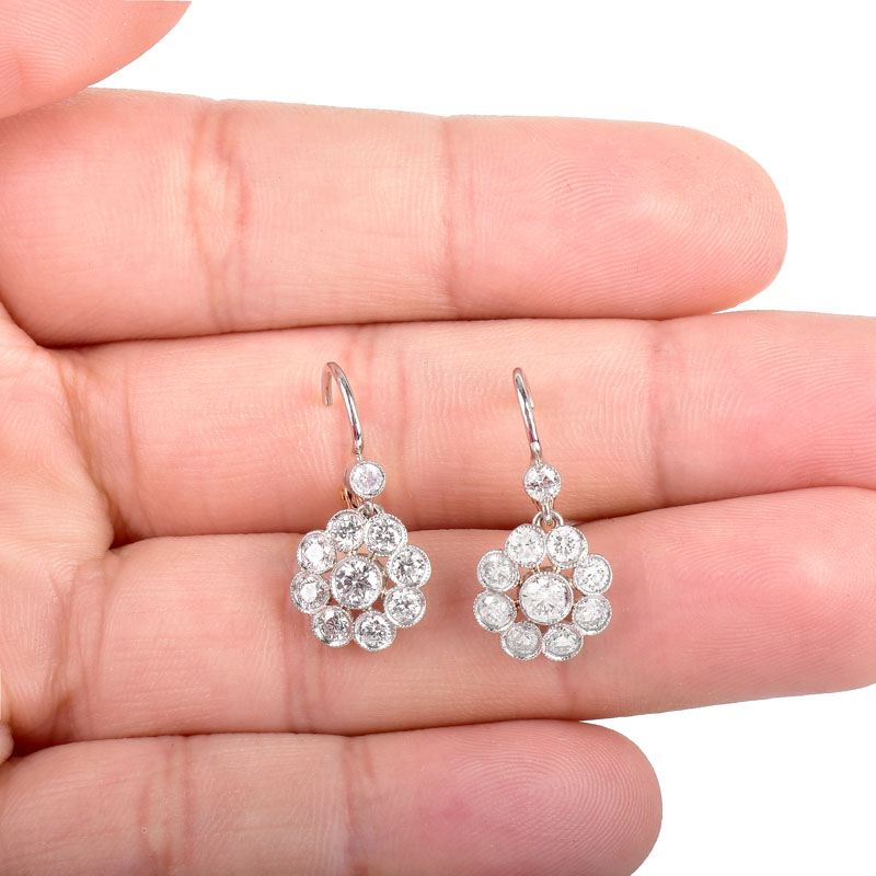Vintage Approx. 2.04 Carat Round Brilliant Cut Diamond and 14 Karat White and Yellow Gold Dangle Flower Earrings. Diamonds G-H color, VS-SI clarity.