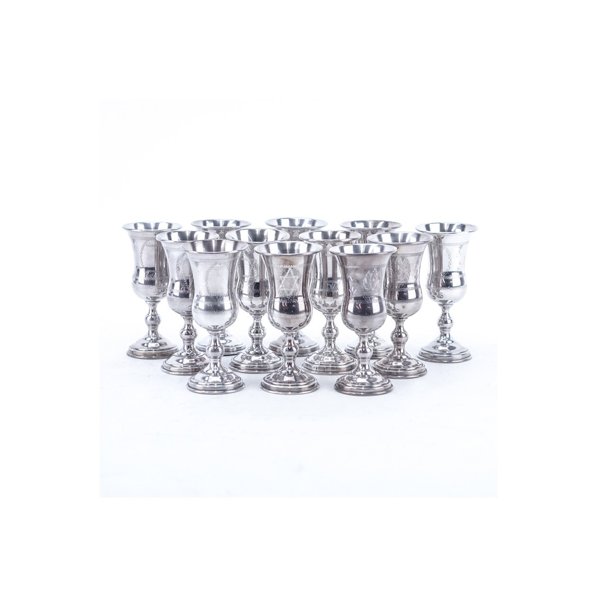 Set of Twelve (12) Sterling Silver Kiddush Cups. All appropriately stamped to base, four are stamped 84 silver.