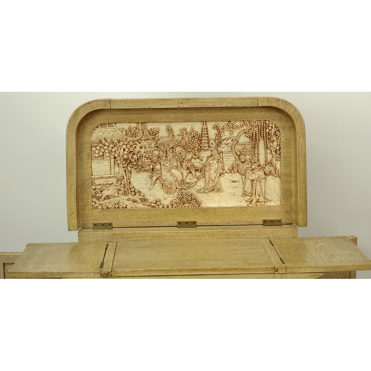 Vintage Chinese Motif Carved Wood Liquor Cabinet. Top lifts to reveal busy carved scene and fold out panels for serving.
