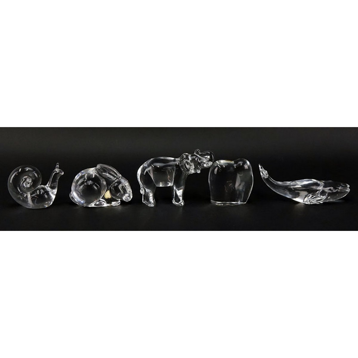 Grouping of Five (5) Paperweights: Baccarat Crystal Elephant, Baccarat Crystal Elephant with Trunk Up, Baccarat Crystal Whale, Steuben Crystal Snail, Val St. Lambert Crystal Rabbit.