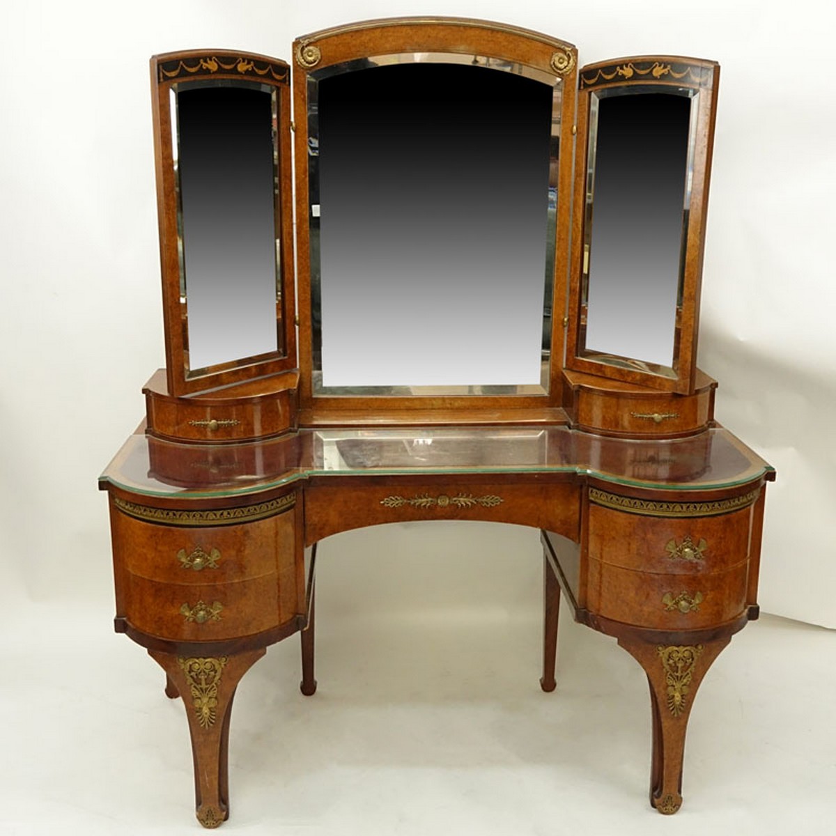 Antique Style French Burlwood Inlaid Gilt Brass Mounted Lady's Dressing Table Mirror. Total of seven drawers, three panel mirror, standing tapering bracket legs.