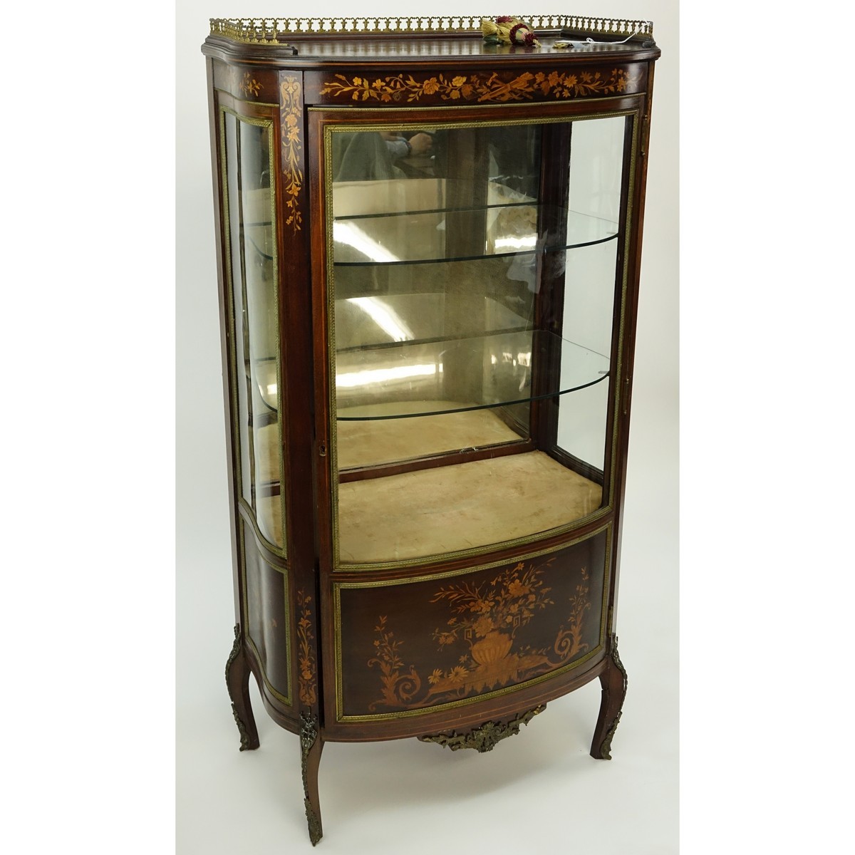 Tall Mid Century French Louis XVI Style Inlaid, Gilt Brass Mounted Vitrine. Floral inlay throughput the panel and top apron, gallery, stands on curved tapering legs, key included.