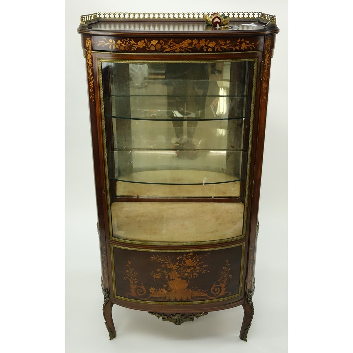 Tall Mid Century French Louis XVI Style Inlaid, Gilt Brass Mounted Vitrine. Floral inlay throughput the panel and top apron, gallery, stands on curved tapering legs, key included.