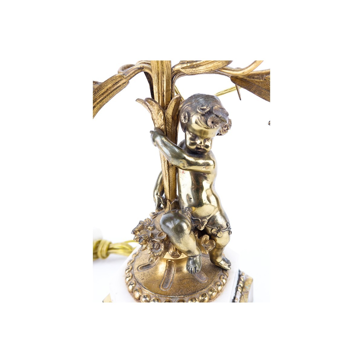 Pair of Gilt Brass Putti Two Light Electrified Candelabras. Each have been repaired, residue to surface, rubbing to gilt.
