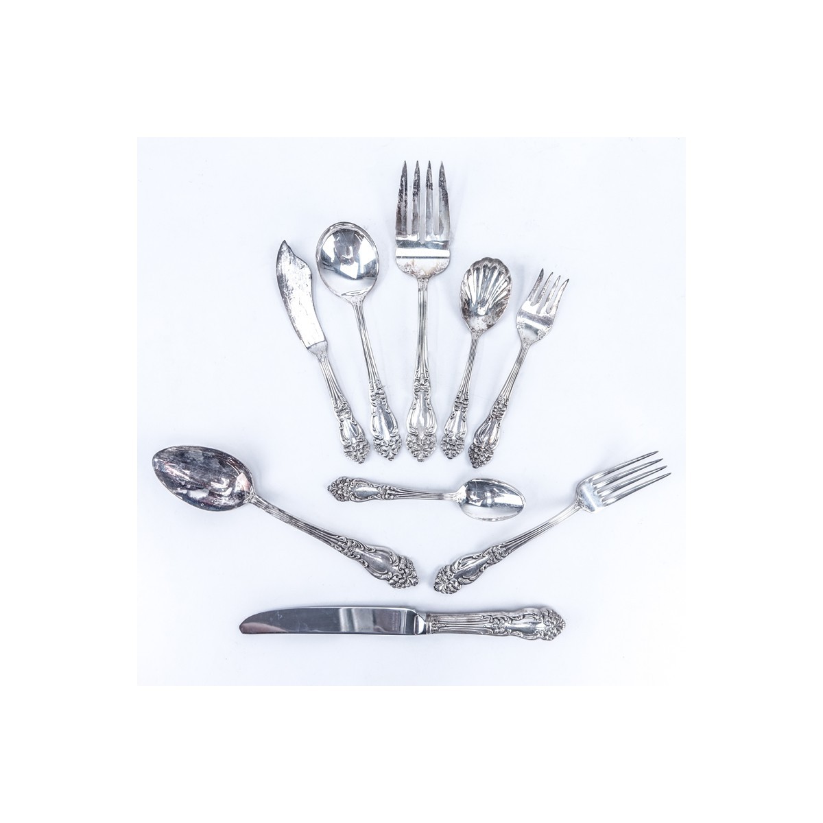 Seventy Six (76) Piece Reed and Barton "Festivity" Silver Plated Flatware. Includes: 12 forks 7-5/8", 12 salad forks 6-1/4", 1 tablespoon 8-1/4", 12 round bowl soup spoon 7-1/8", 24 teaspoons, 12 knives 9-1/2", cold meat fork, flat master butter spreader,