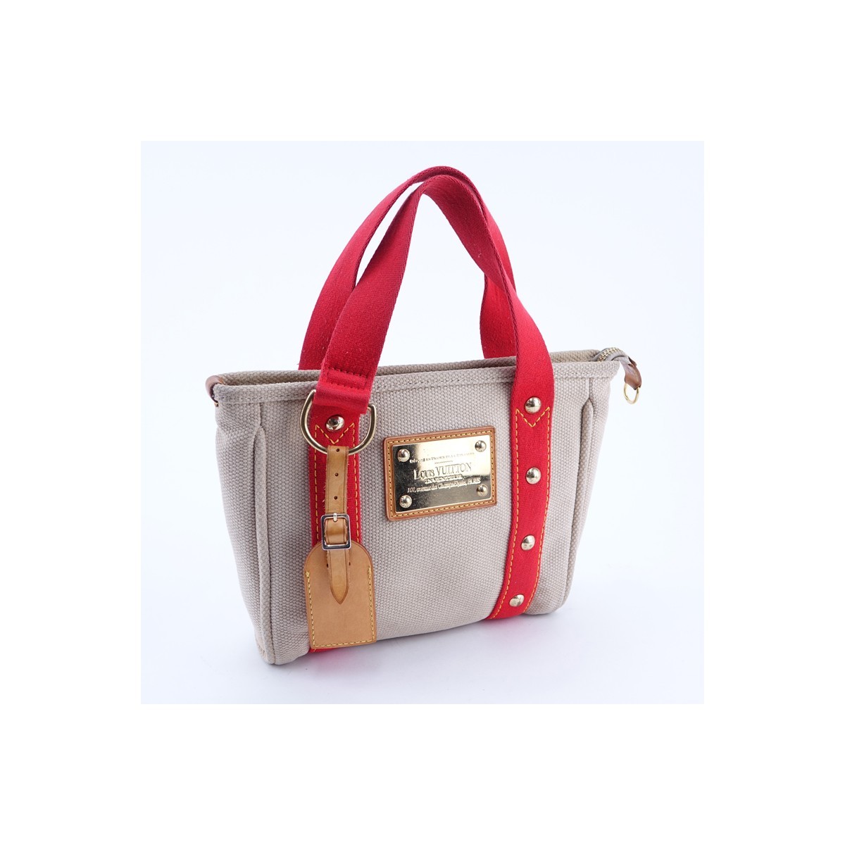 Louis Vuitton Beige/Red Canvas Antigua Cabas PM Tote. Golden brass hardware, striped fabric interior with patch pockets.