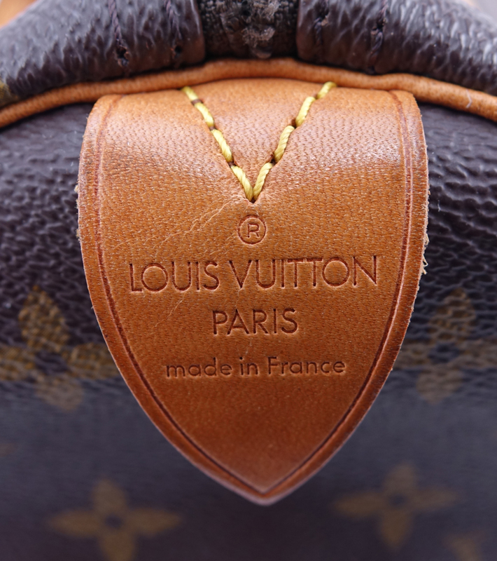 Louis Vuitton Brown Monogram Coated Canvas Speedy 35 Tote. Golden brass hardware, vachetta straps.