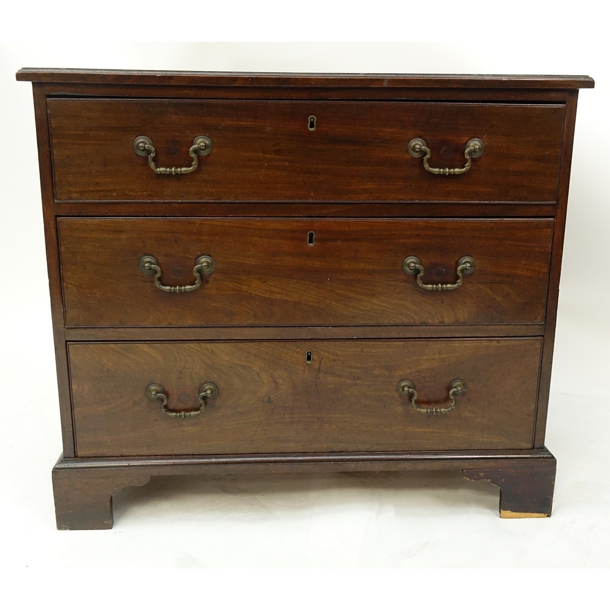 19th Century English Georgian Mahogany Chest of Drawers/Commode. Three large sliding drawers with bracket feet.