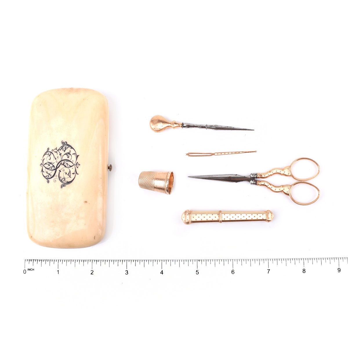 19th Century French 18 Karat Yellow Gold Sewing Kit in Fitted Ivory Box Including Scissors, Thimble, Needle Case, Needle and a Hole Punch. French eagle head hallmark.