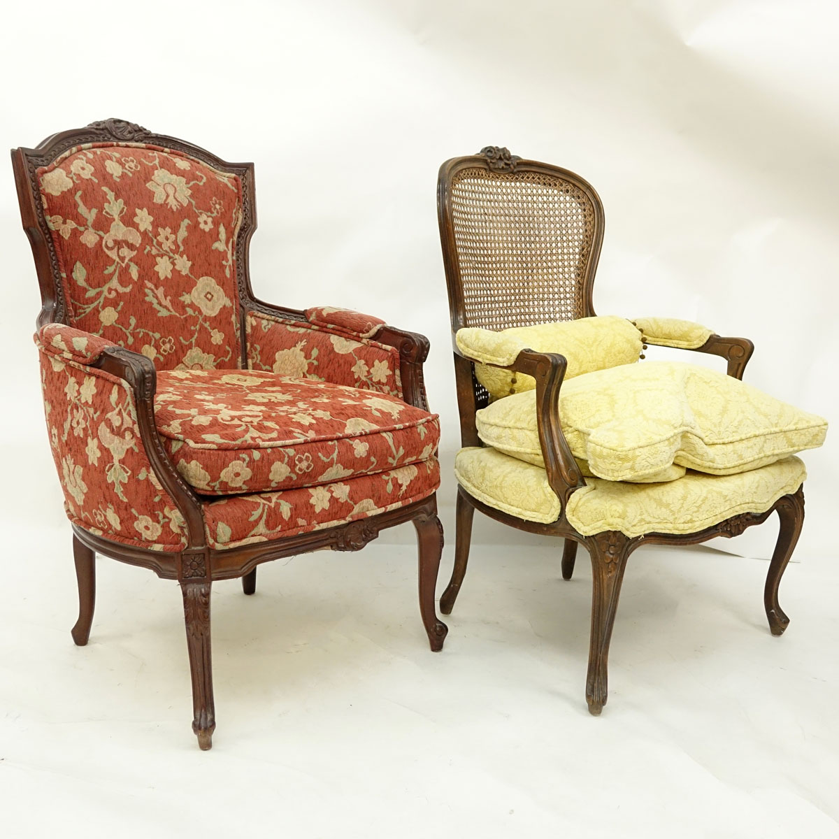 Two (2) 20th Century French Carved Louis XV style Chairs, Fauteuil with Cane Back and Bergere. Unsigned.