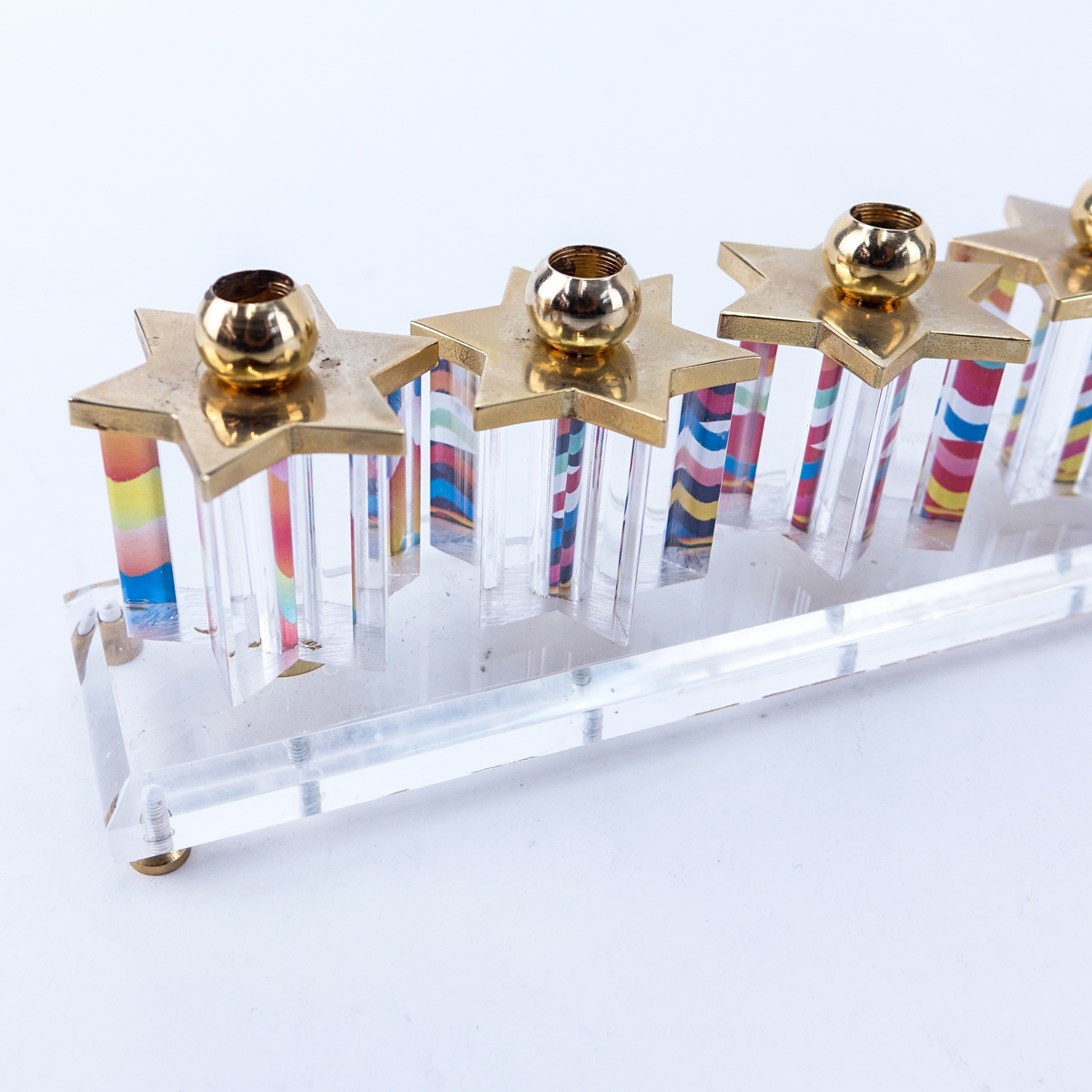 Grouping of Five (5): Large Lucite and Brass Menorah,   Four Lucite and Brass Dreidels. All made by Jerusalem Crystalight in commemoration of Israel's 50 year anniversary.