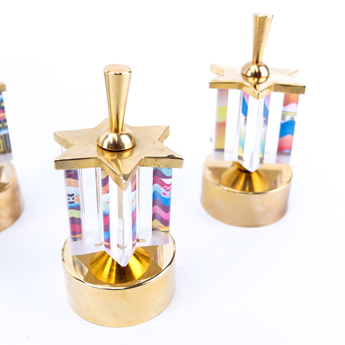 Grouping of Five (5): Large Lucite and Brass Menorah,   Four Lucite and Brass Dreidels. All made by Jerusalem Crystalight in commemoration of Israel's 50 year anniversary.