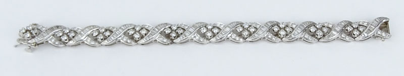 Retro Lady's Round Brilliant Cut and Baguette Diamond and Platinum Bracelet. Approx.