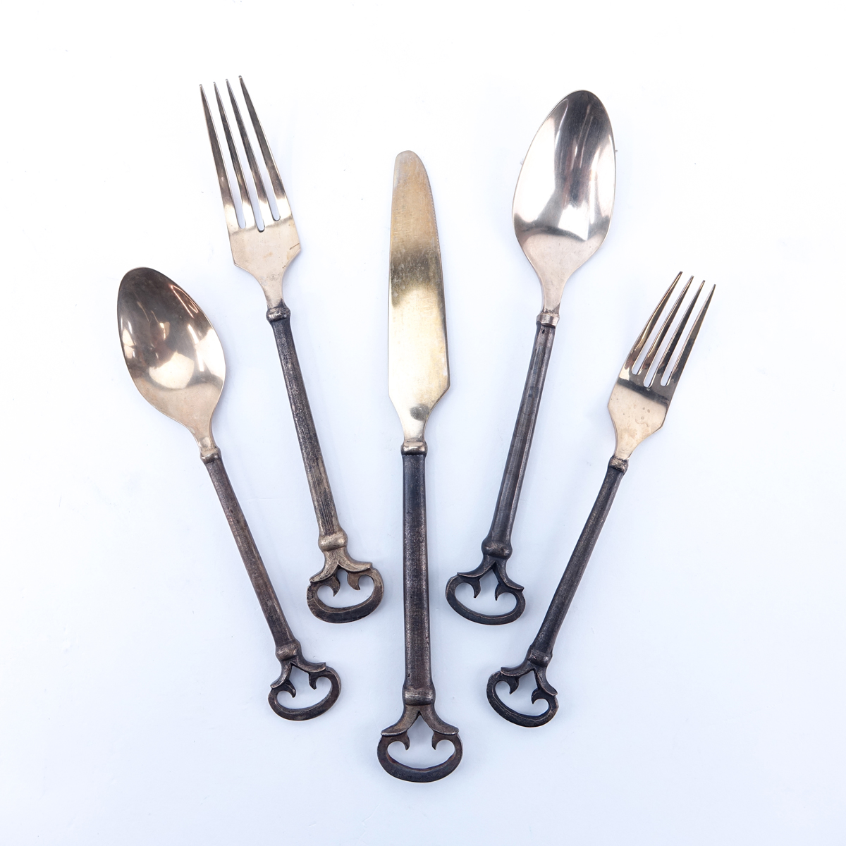 Forty (40) Piece Set Antique Solid Brass Flatware. Includes 8 each: forks 8-1/8", knives 9-1/2", salad forks, place spoons, teaspoons.