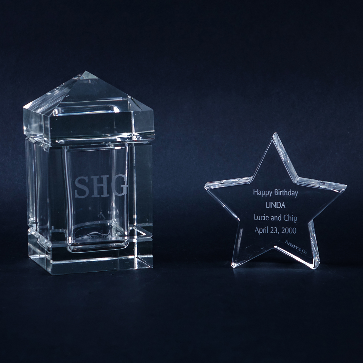 Two (2) Designer Crystal Keepsakes. Includes a Tiffany Star with etched inscription 4-1/4" H and a Cartier "Obelisk" Box Monogramed SHG 6-1/2" H.