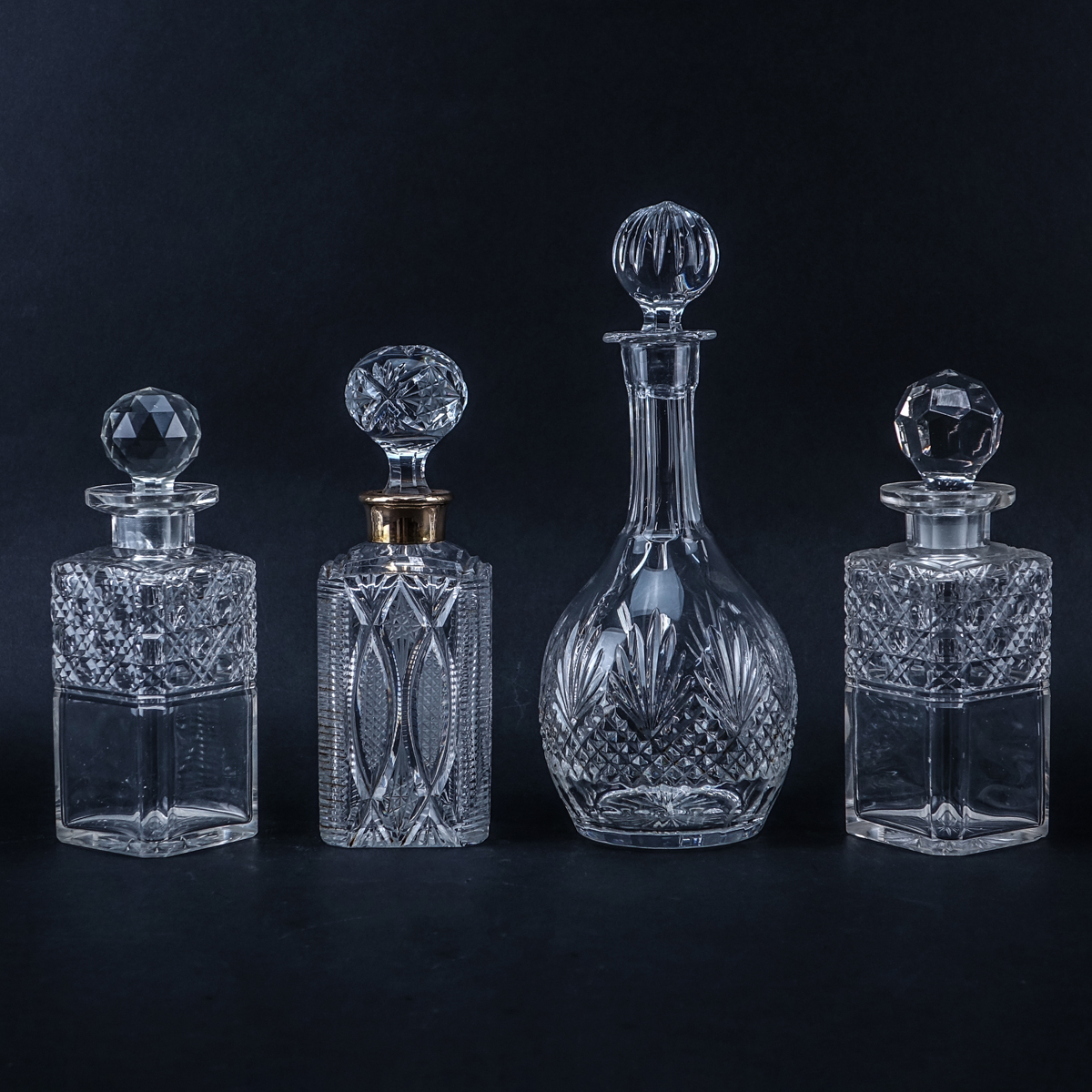 Collection of Four (4) Crystal Decanters. Unsigned.