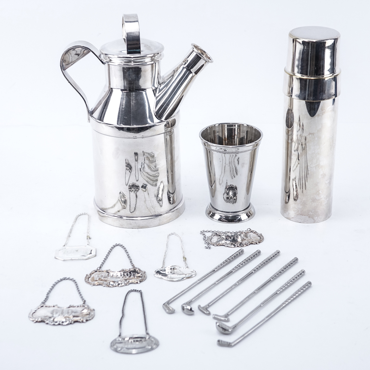 Grouping Of Silver Plate Bar Accessories. Includes: Reed & Barton shaker/decanter, Towle shaker, Towle tumbler, 6 golf club motif stirrers, 6 decanter labels.