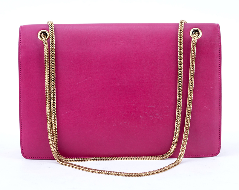 Saint Laurent Fuschia Leather Betty Handbag. Gold tone hardware and chain, suede interior with patch pocket.