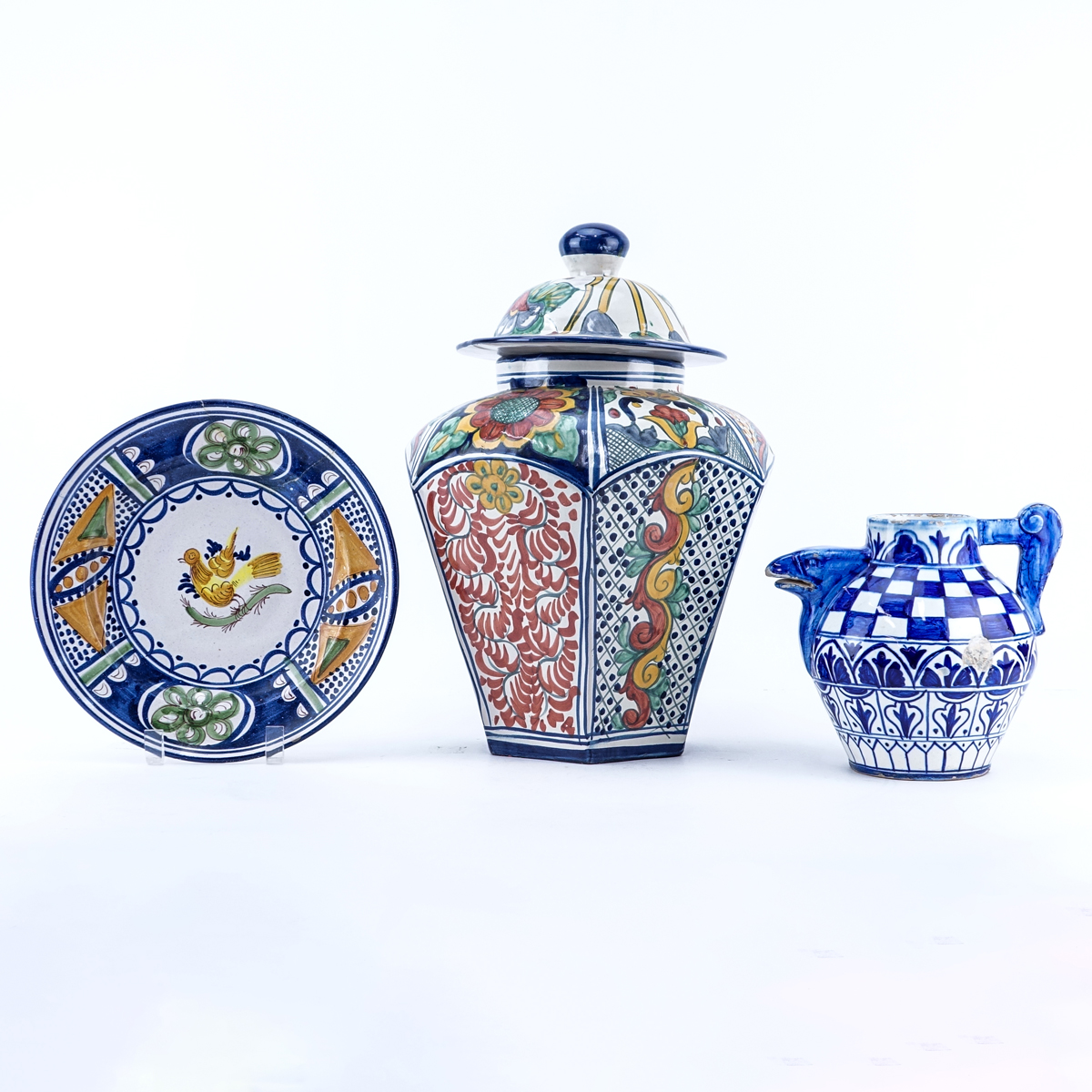Grouping of Three (3): Large Mexican Faience Pottery Covered Jar, Faience Pottery Cabinet Plate, and Faience Pottery Pitcher. Covered jar is signed others are unsigned.